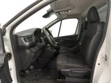 the interior of a white van with black leather seats and a steering wheel