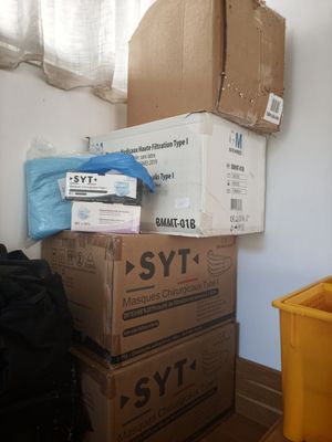 many boxes stacked on top of each other on the floor