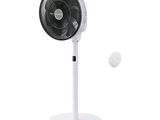 an image of a white table fan with a tennis ball in front of it