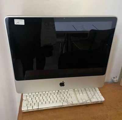 a computer on a desk with a keyboard and mouse