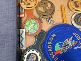 a picture of a tray of medals and other items