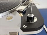 a turntable with a remote on top of it