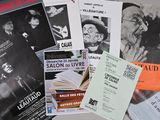 a lot of posters and pamphlets on the table