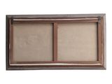 an old wooden window frame with two open panes on it