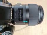 a close up of a camera with a lens attached to it