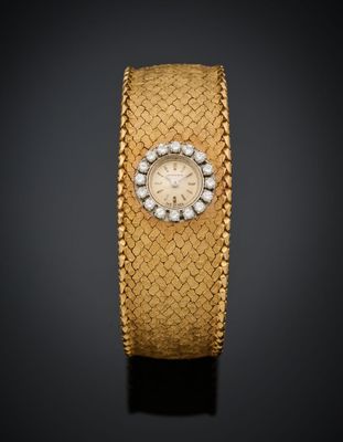une montre-bracelet en or 18 carats et diamants, signée Cartier