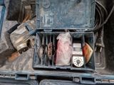 a tool box filled with tools and other items on the ground