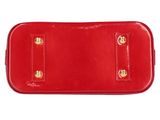 a close up of a red purse on a white background
