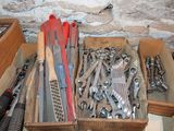 many different tools in a box on the table