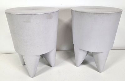 pair of concrete stools with legs and feet