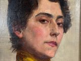 portrait of a woman in a black dress with a yellow scarf