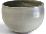 a white bowl that is sitting on a white surface