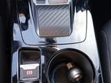 the interior of a car with a blue and black dash panel