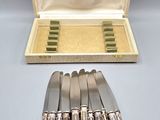 six silverplated knives in a case and six knives in a box