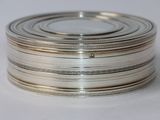 a stack of silver plates stacked on top of each other