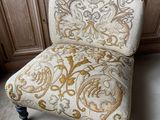 a chair that is sitting in the middle of a room