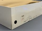 a white box with a brown cloth inside of it