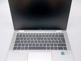 an open laptop computer sitting on top of a white table