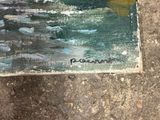 a picture of a painting on the ground by the water