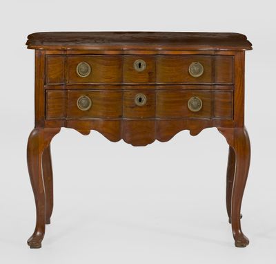 a small wooden chest of drawers on a stand