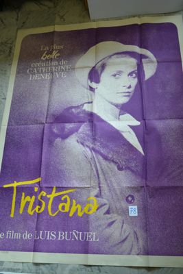 an old movie poster of a man in a hat and coat