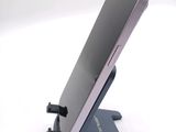a cell phone that is sitting on a stand