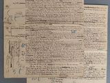 un vieux document écrit posé sur une table