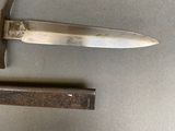 a knife that is laying on a table