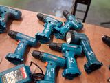 a lot of power tools that are on a table