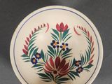 an image of a white bowl with a flower design on it