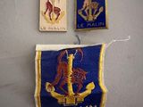 two patches of different colors and sizes on a white surface
