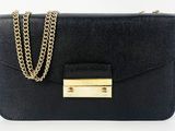 a black purse with a gold chain on it