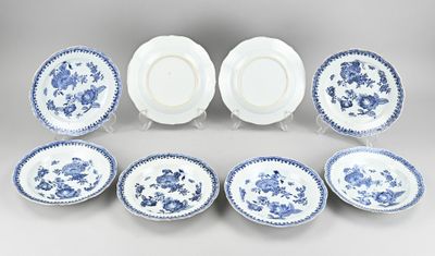 a set of six blue and white plates with floral designs