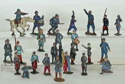 a lot of figurines that are on a shelf