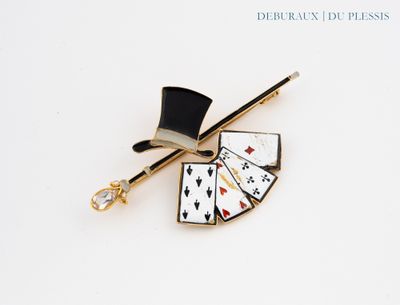 a picture of a pin with a top hat and playing cards on it