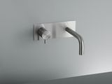 a faucet that is attached to a wall mounted faucet
