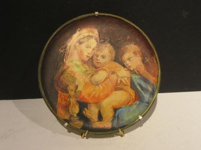 a plate with a painting of a woman holding a child
