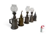 five different types of oil lamps on a white background