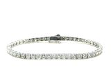 a diamond tennis bracelet on a white background