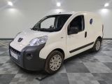 a picture of a white van parked on a checkered floor