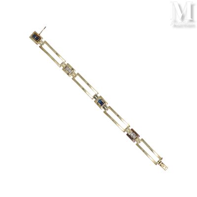 un gros plan sur un bracelet en argent orné de pierres bleues et blanches