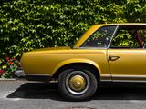 a yellow car parked on the side of the road