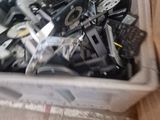 a box full of assorted cell phones sitting on the floor