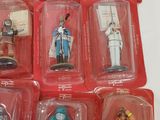 a lot of different toy figures in the plastic case