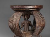 an image of a wooden table with a statue on top of it