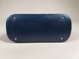 a blue leather case with rivets and rivets on the sides
