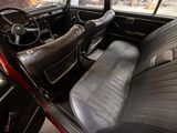 a view of the inside of a car from the driver ' s seat