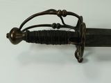 a sword that is on display on a table