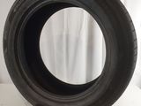 a close up of a tire on a white surface