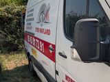 a white van that is parked in the grass